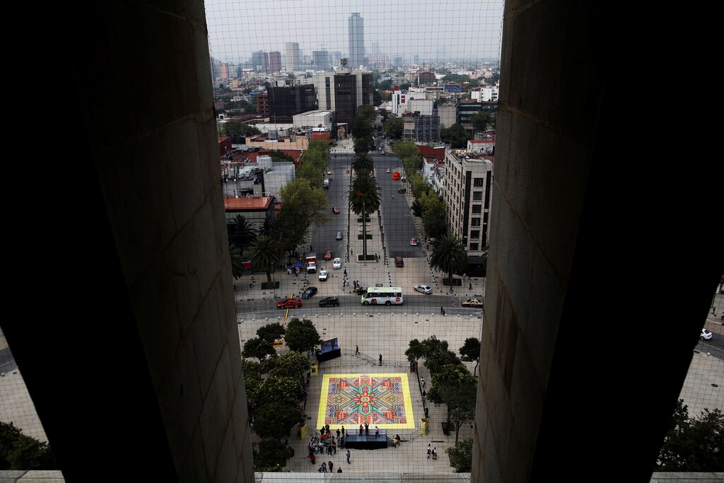 26,896 cans of Play-Doh are pictured below the skyline during a Guinness World Records attempt for the biggest mosaic, inspired by indigenous Huichol art, as part of a promotional event celebrating the product's 60th anniversary, in Mexico City, Mexico September 23, 2016.September 23, 2016. REUTERS/Carlos Jasso - RTSP6OR