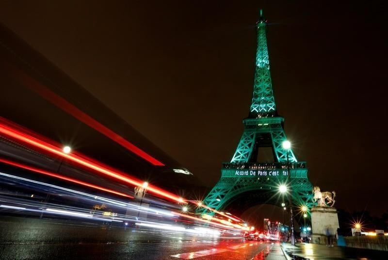 The Eiffel tower is illuminated in green with the words "Paris Agreement is Done", to celebrate the Paris U.N. COP21 Climate Change agreement in Paris, France, November 4, 2016. REUTERS/Jacky Naegelen - RTX2RZ42