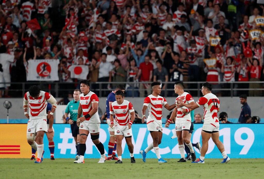 Rugby Union - Rugby World Cup 2019 - Pool A - Japan v Russia - Tokyo Stadium, Tokyo, Japan - September 20, 2019 Japan's Kotaro Matsushima celebrates scoring their second try with Ryoto Nakamura and team mates REUTERS/Matthew Childs - RC1919927140