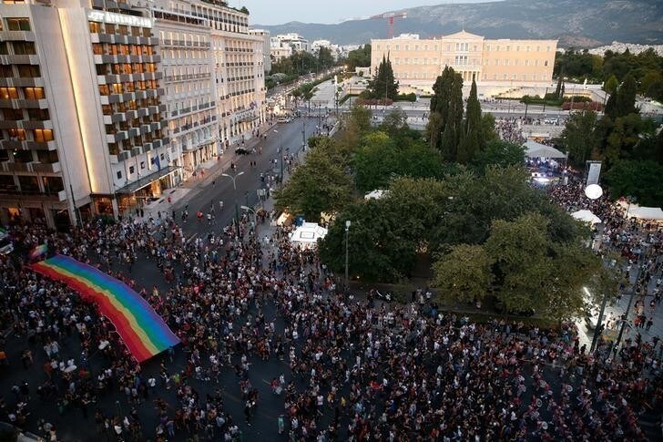 Rainbow flag Parliament building Gay Pride parade Athens Greece discrimination at work