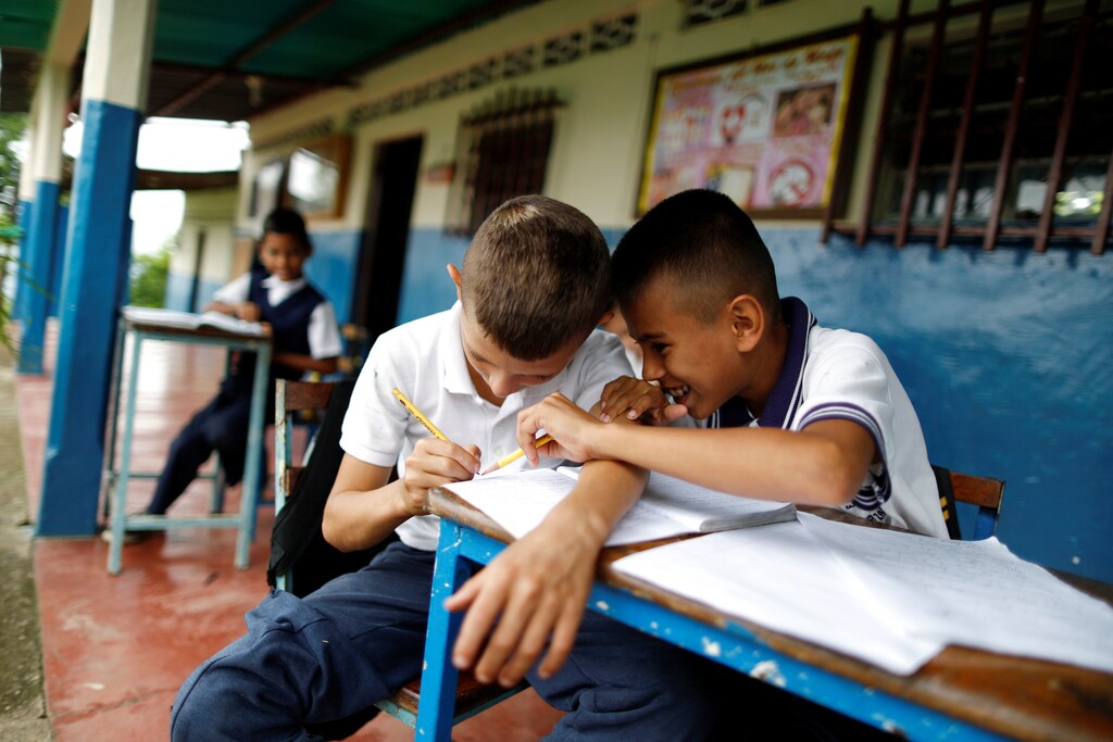 Children attend a class outside their classroom during a power cut at state school Don Felipe Zambrano in Seboruco, Venezuela, June 2, 2016. REUTERS/Carlos Garcia Rawlins SEARCH "VENEZUELA SCHOOL" FOR THIS STORY. SEARCH "THE WIDER IMAGE" FOR ALL STORIES - S1AETKGMOWAA