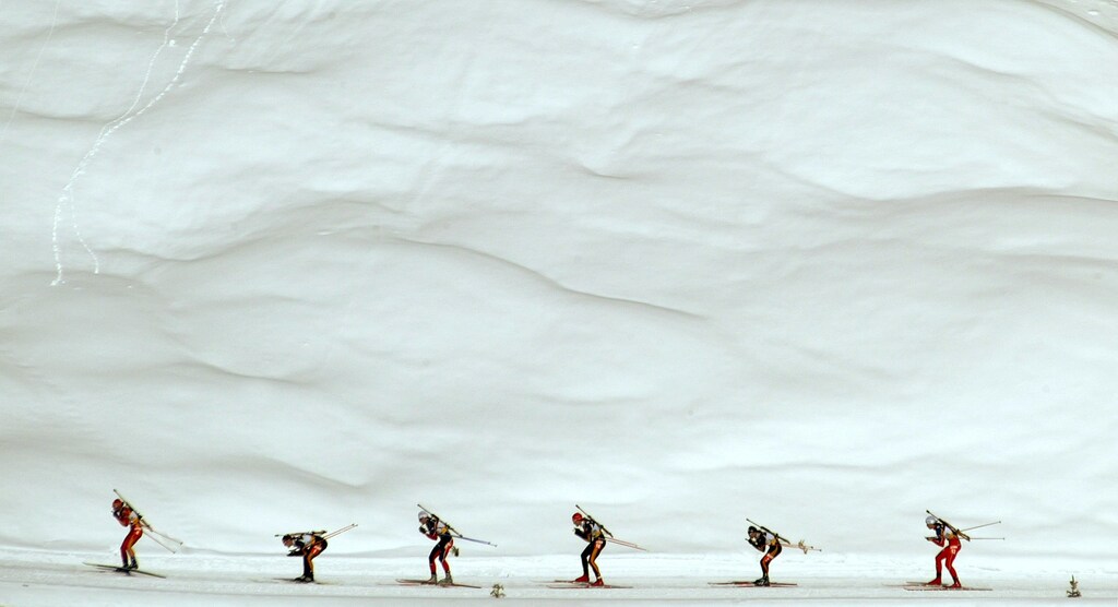 a group of cross country skiers competing in a race