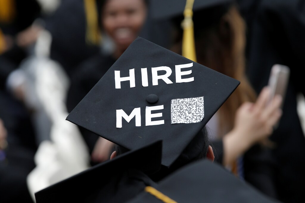 A graduating student of the City College of New York wears a message on his cap during the College's commencement ceremony in the Harlem section of Manhattan, New York, U.S., June 3, 2016.