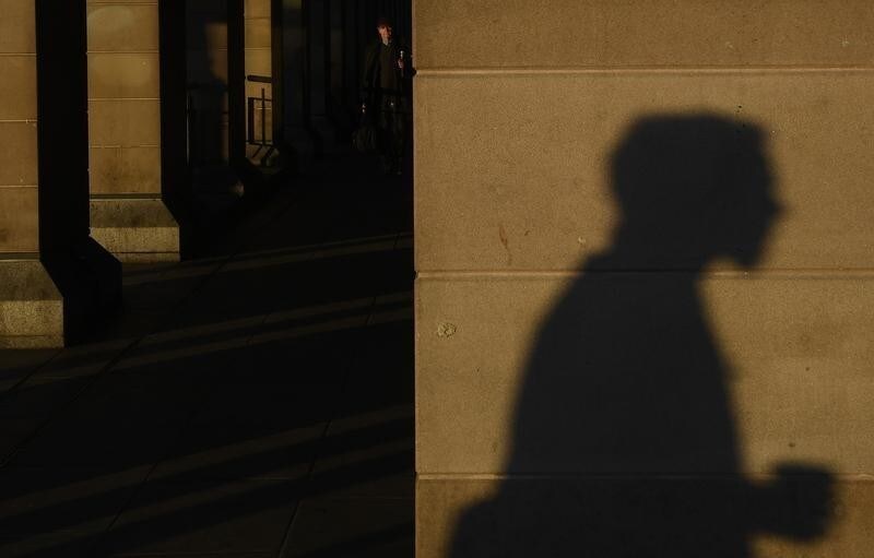 Workers walk through Westminster during the morning rush hour in London in Britain, November 28, 2016. REUTERS/Toby Melville - LR1ECBS0PDYSY