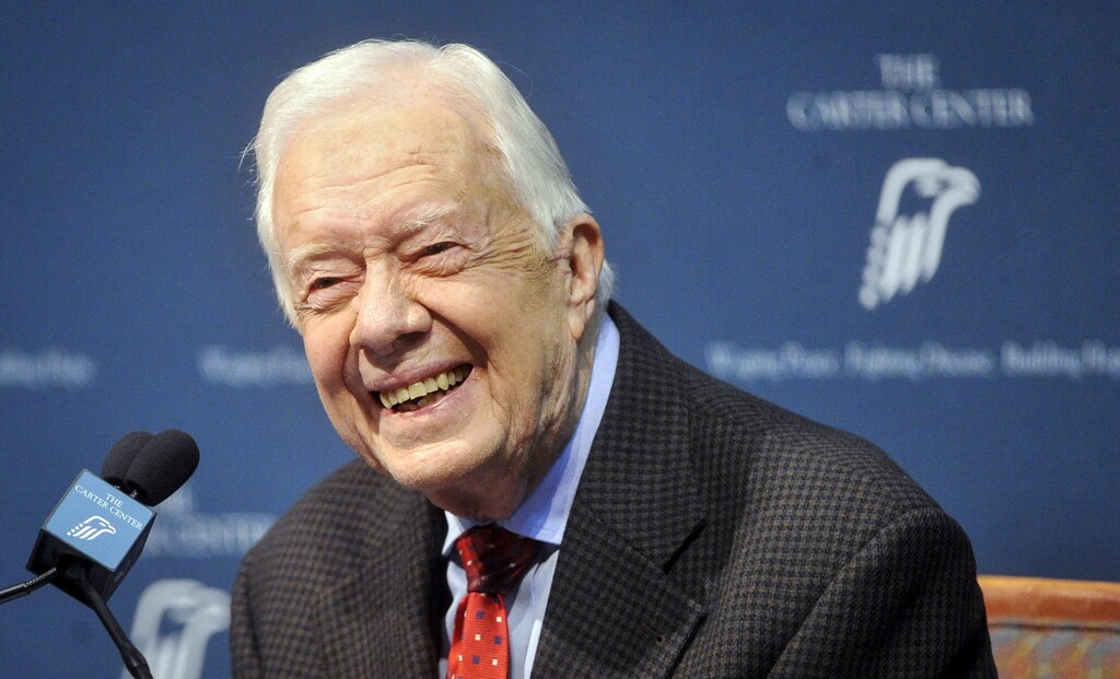 Former U.S. President Jimmy Carter takes questions from the media during a news conference about his recent cancer diagnosis and treatment plans, at the Carter Center in Atlanta, Georgia August 20, 2015. Carter said on Thursday he will start radiation treatment for cancer on his brain later in the day. Carter, 90, said he will cut back dramatically on his schedule to receive treatment every three weeks after doctors detected four spots of melanoma on his brain following recent liver cancer surgery. REUTERS/John Amis TPX IMAGES OF THE DAY - GF10000177526