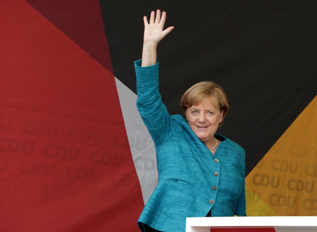 German Chancellor Angela Merkel, a top candidate of the Christian Democratic Union Party (CDU), greets audience during the election rally ahead of the upcoming federal election in Annaberg-Buchholz, Germany August 17, 2017. REUTERS/Matthias Schumann - RTS1C71T