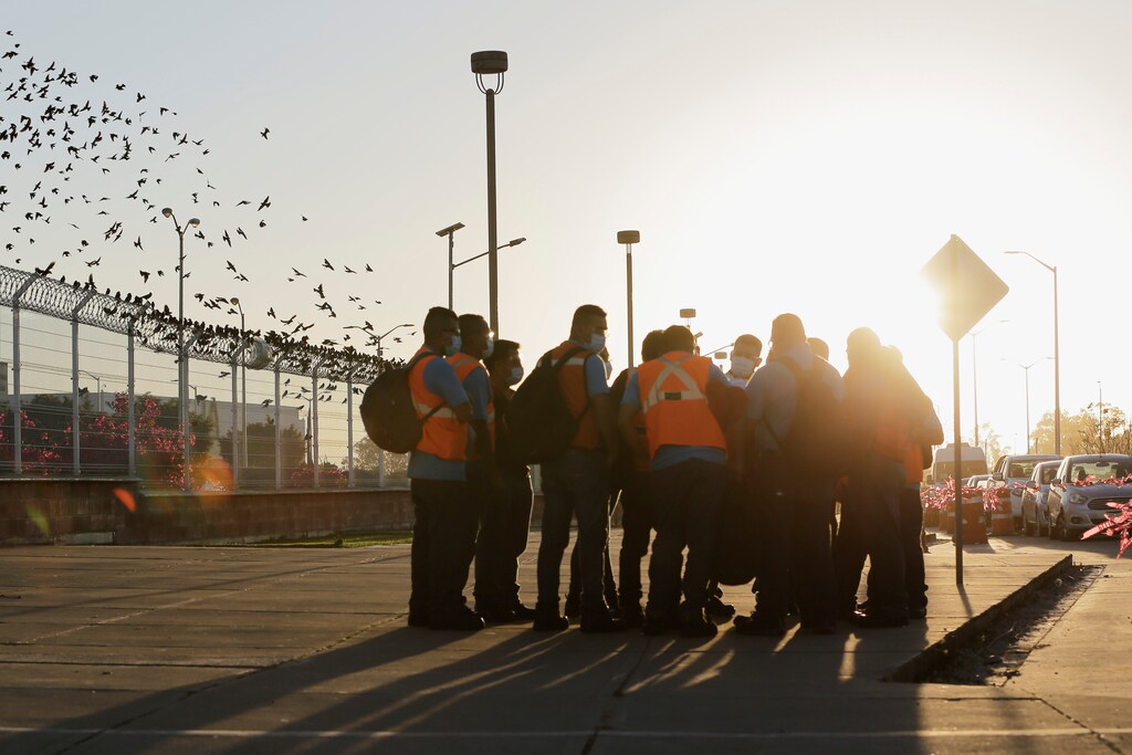 Mexican workers gather outside the General Motors pickup truck plant after voting to elect a new union under a labour reform that underpins a new trade deal with Canada and the US.