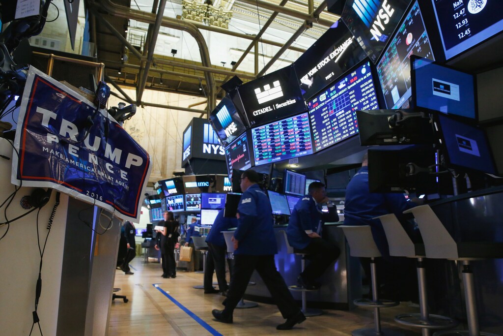 An electoral poster of Donald Trump is displayed on the floor of the New York Stock Exchange (NYSE) the morning after the U.S. presidential election in New York City, U.S., November 9, 2016. REUTERS/Brendan McDermid - RTX2SVIY