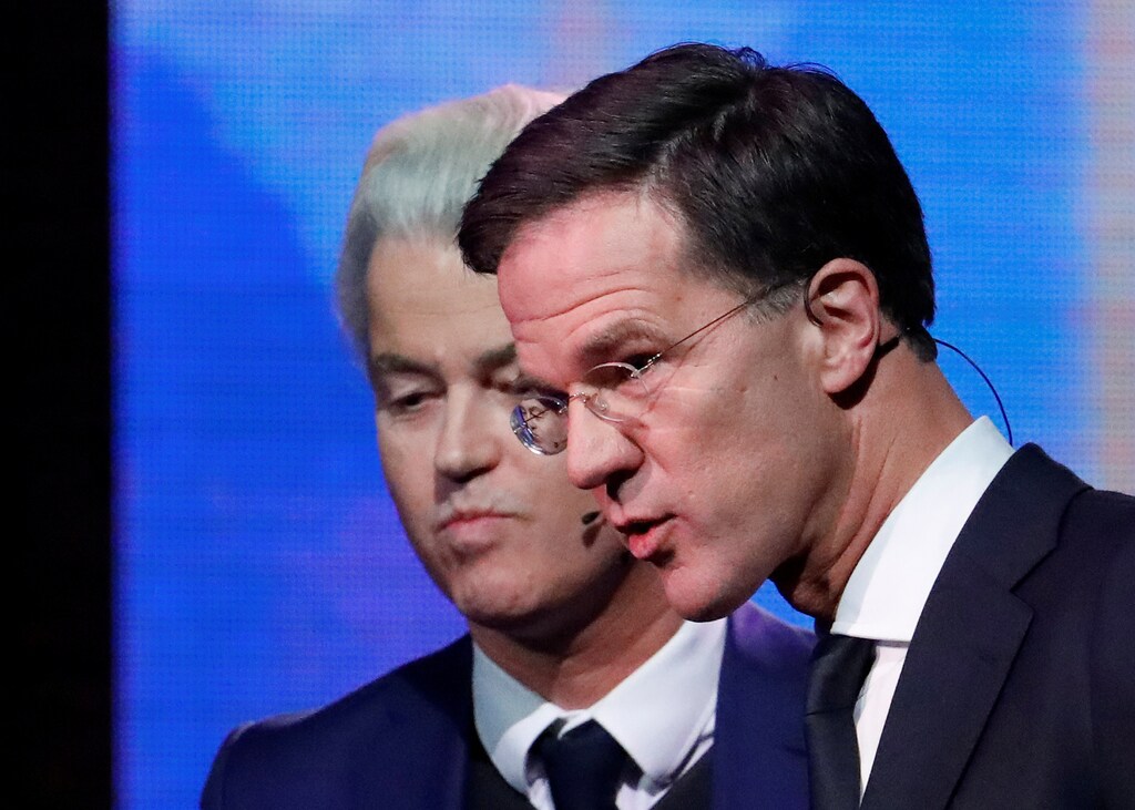 Dutch far-right politician Geert Wilders of the PVV party and Dutch Prime Minister Mark Rutte (R) of the VVD Liberal party take part in the "EenVandaag" debate in Rotterdam, Netherlands, March 13, 2017. REUTERS/Yves Herman TPX IMAGES OF THE DAY - RTX30UP8