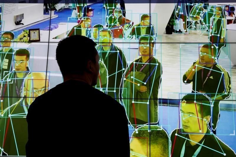 A man looks at a demonstration of human motion analysis software at the stall of the artificial intelligence solutions maker Horizon Robotics during the Security China 2018 exhibition on public safety and security in Beijing, China October 24, 2018.