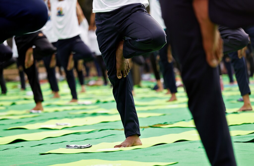 People perform yoga at India Gate on International Yoga Day in New Delhi, India, June 21, 2018. REUTERS/Saumya Khandelwal