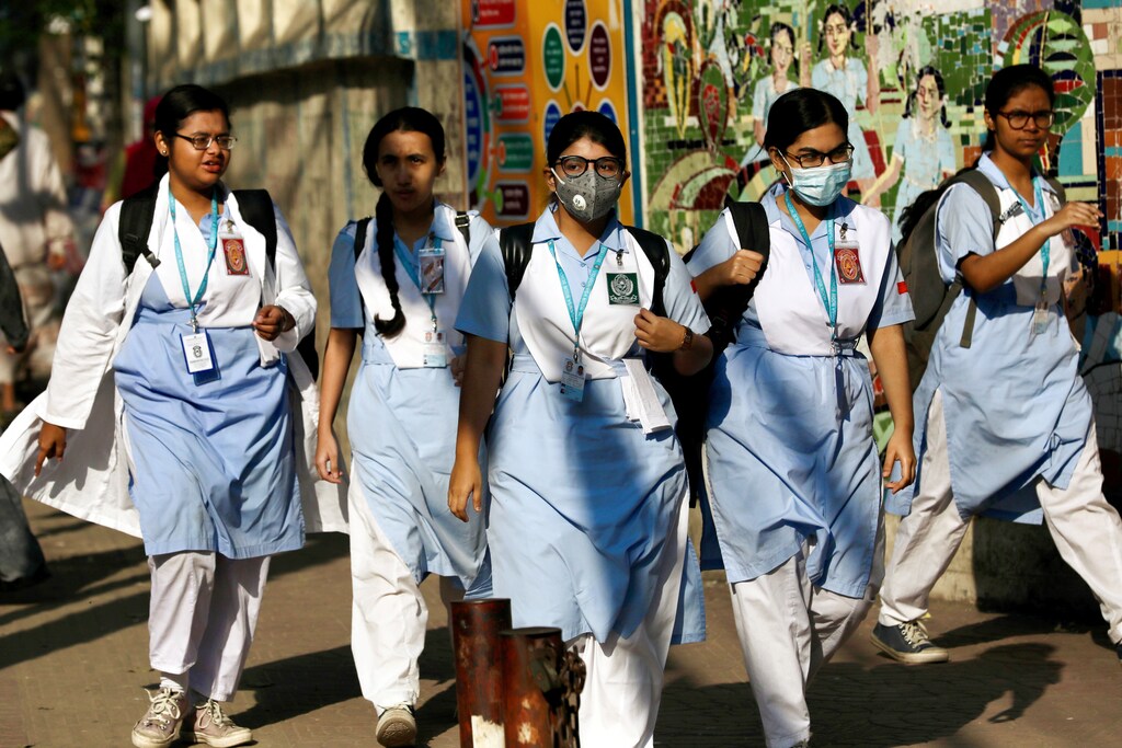 School girls wear masks as a protective measure after the first reported case of coronavirus in Dhaka, Bangladesh March 10, 2020.