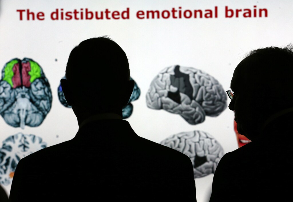 The Swiss President Johann Schneider-Ammann and his Portuguese counterpart Marcelo Rebelo de Sousa, listen to explanations on brain researches at the Wyss Center, part of Campus Biotech, during Marcelo Rebelo de Sousa's State visit in Geneva, Switzerland October 17, 2016. REUTERS/Denis Balibouse - RTX2P4ZL