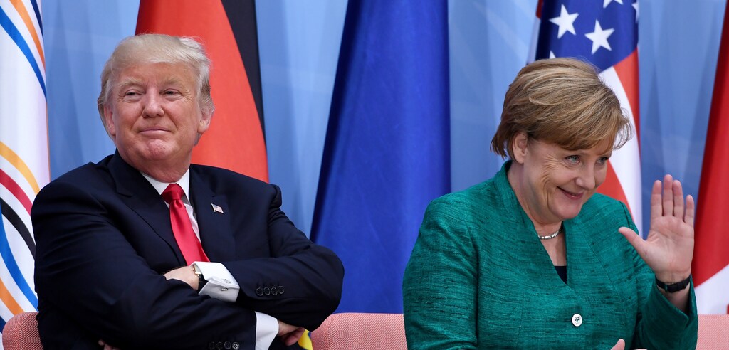 US President Donald Trump (L) and German Chancellor Angela Merkel attend the panel discussion "Launch Event Women's Entrepreneur Finance Initiative" on the second day of the G20 Summit in Hamburg, Germany, July 8, 2017. REUTERS/Patrik STOLLARZ/Pool - RTX3AM4K
