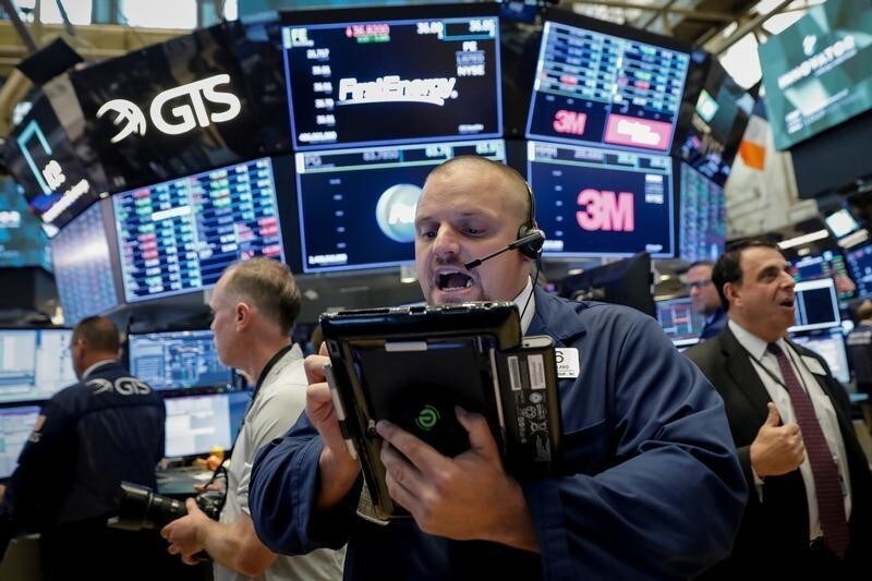 Traders work on the floor of the New York Stock Exchange (NYSE) in New York, U.S., August 22, 2018.