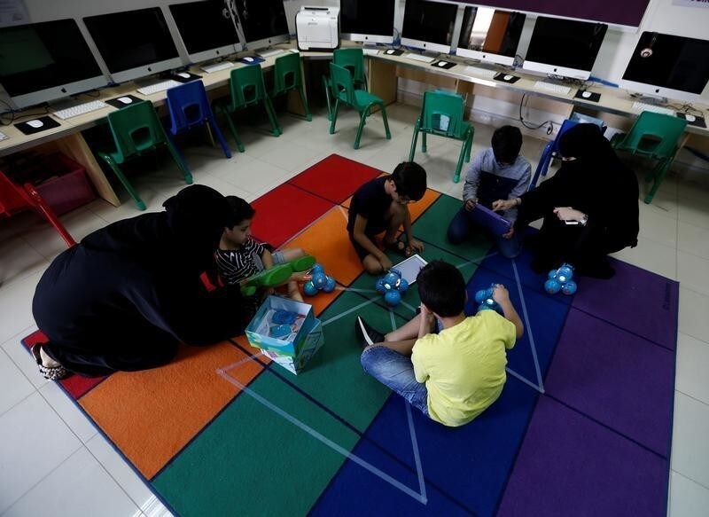Saudi women teach children computer programming using robots connected with an application as part of Kcoderz social initiative launched by a Saudi couple, in Riyadh, Saudi Arabia, July 29, 2017. Picture taken July 29, 2017. REUTERS/Faisal Al Nasser - RC122D4445D0
