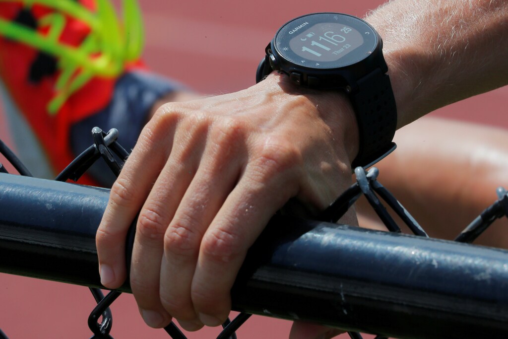 A runner wearing a Garmin smart watch, a device which some experts are studying to determine if it might be used to help detect early coronavirus disease (COVID-19) infection.