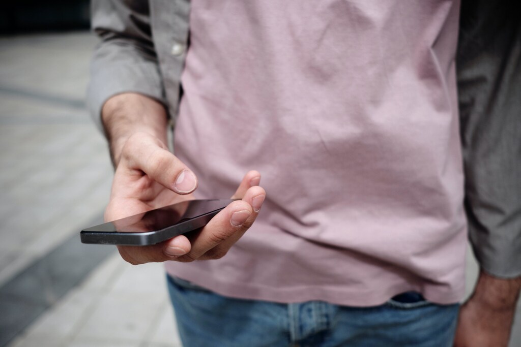 some people have argued that too much digital screen time can be bad for mental health, like this person on their phone here