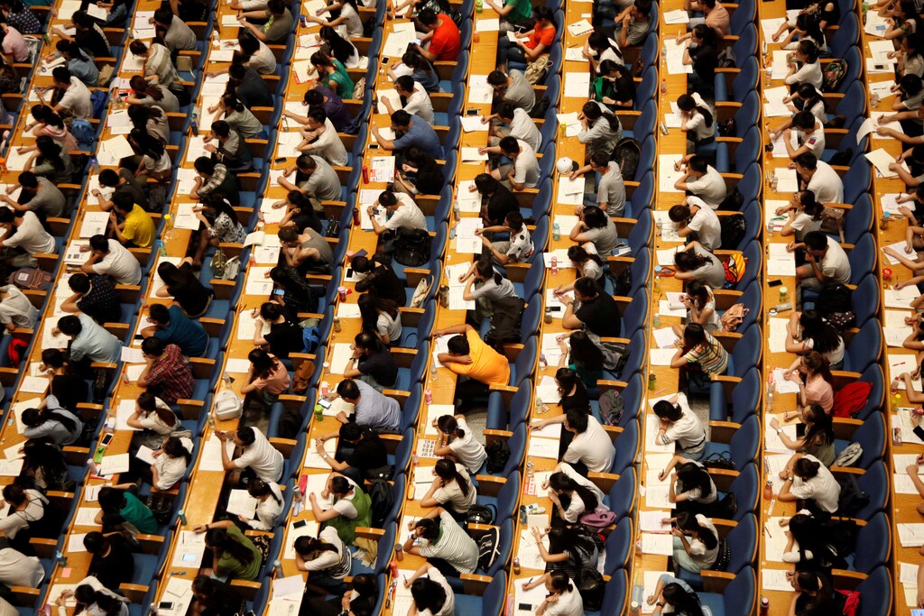Students attend a lecture for the entrance exam for postgraduate studies at a hall in Jinan, Shandong Province, China, July 18, 2016. Picture taken July 18, 2016.