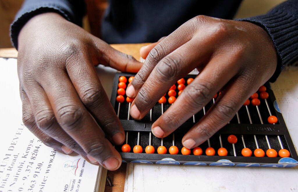 A pupil uses an abacus to calculate during a mathematics lesson, amid the spread of the coronavirus disease (COVID-19) at the Thika school for the blind in Thika town of Kiambu county in Kenya October 29, 2020. Picture taken October 29, 2020. REUTERS/Monicah Mwangi - RC2OVJ9D9CMN