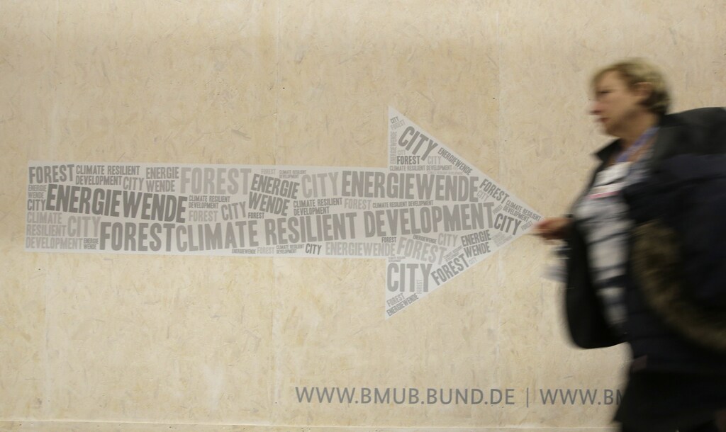 A visitor walks past the German pavilion during the World Climate Change Conference 2015 (COP21) at Le Bourget, near Paris, France, December 1, 2015.