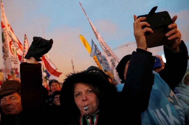 People take part in a protest against a proposed new labor law, billed as the "slave law", in Budapest, Hungary, January 5, 2019. REUTERS/Bernadett Szabo - RC128FD99340