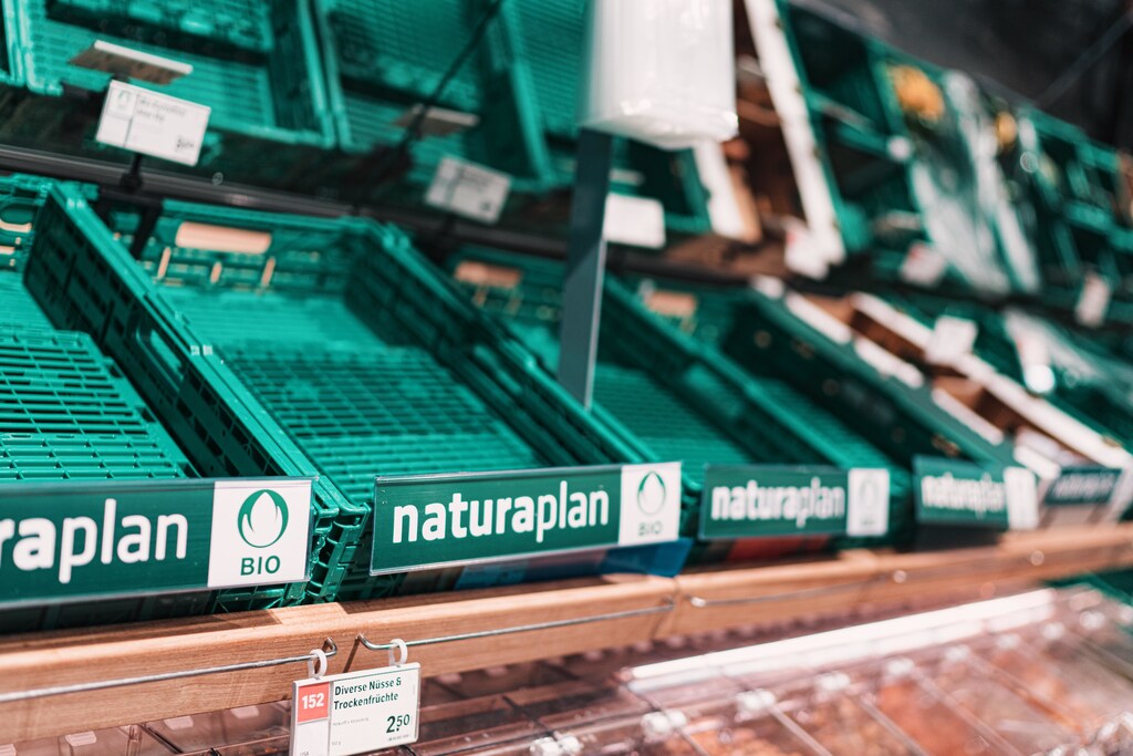 Empty food shelves in a supermarket.