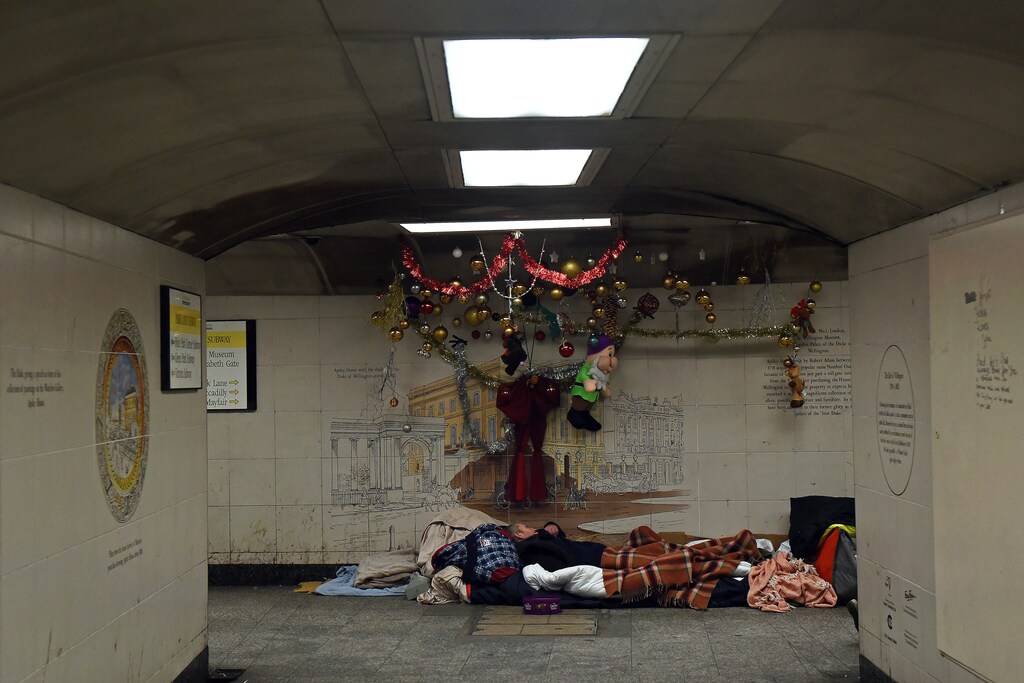 Homeless man Kel sleeps in the spot where he lives in the subway next to Hyde Park Station in London, Britain, December 19, 2017. REUTERS/Mary Turner SEARCH "TURNER HOMELESS" FOR THIS STORY. SEARCH "WIDER IMAGE" FOR ALL STORIES. TPX IMAGES OF THE DAY - RC14F3C0C600