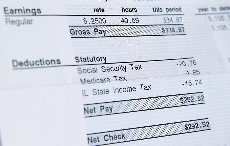 A recent paycheck for Delores Leonard shows her hourly wage of $8.25 for working at a McDonald's Restaurant, the minimum wage in Illinois, in Chicago, Illinois, September 29, 2014. Leonard, a single mother raising two daughters, has been working at McDonald's for seven years and has never made more than minimum wage.