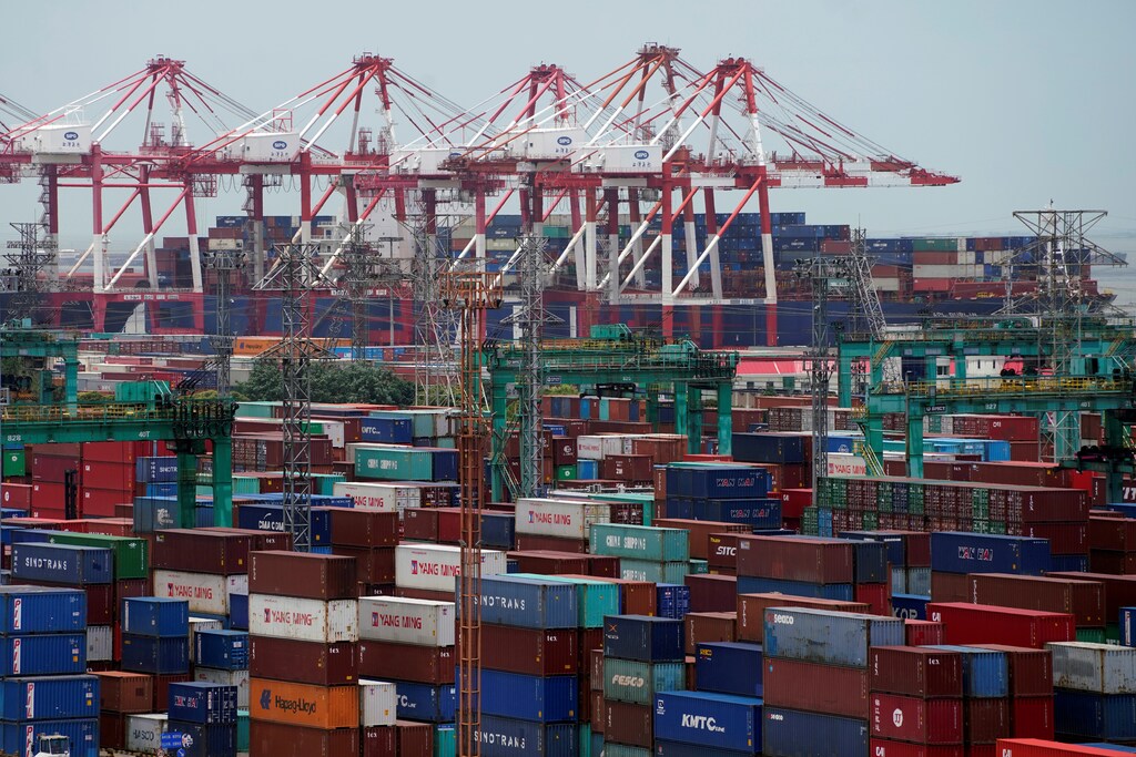 Shipping containers are seen at a port in Shanghai, China July 10, 2018. REUTERS/Aly Song - RC11AE1615D0