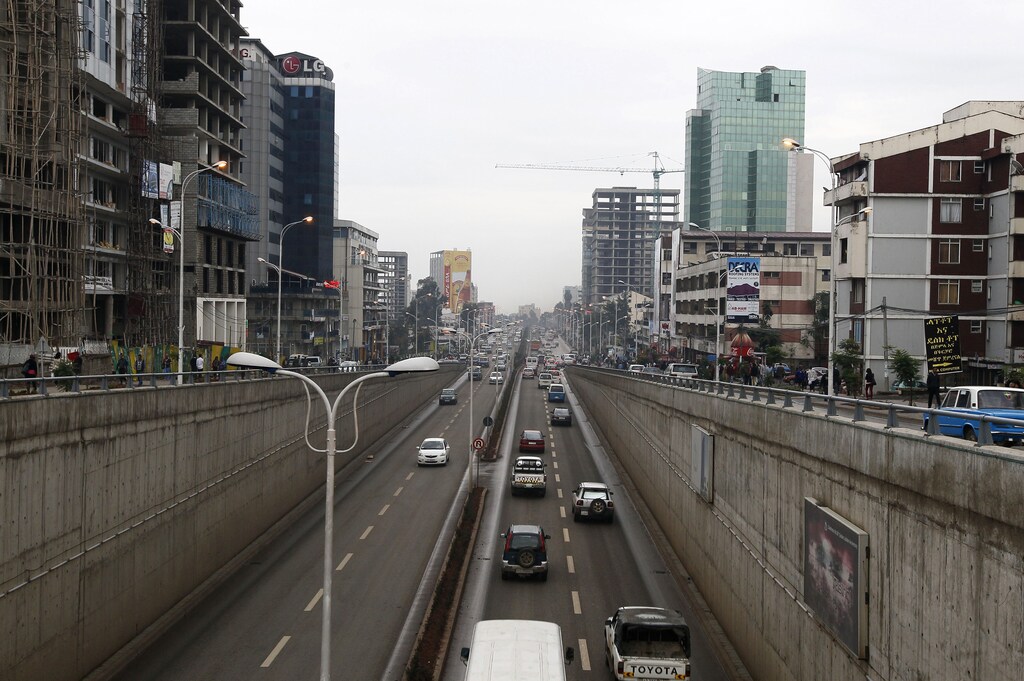 Cars drive out of an underpass in Addis Ababa May 26, 2014. Ethiopia has pushed the door ajar for foreign retailers keen to enter the fast-growing market of 90 million people, welcoming them as managers but keeping the state in control. To match story ETHIOPIA-RETAIL/ REUTERS/Tiksa Negeri (ETHIOPIA - Tags: BUSINESS TRANSPORT POLITICS) - RTR3QYPU