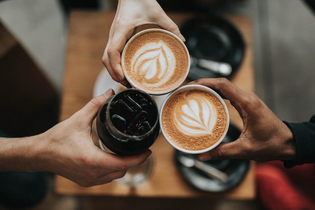 People having coffee together.
