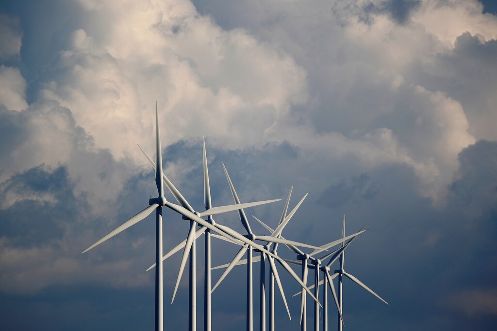 Power-generating wind turbines are seen at a wind park near Greneville-en-Beauce, France, November 30, 2017