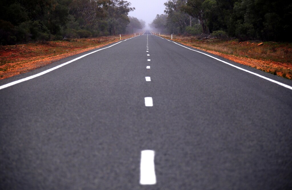 A bitumen road is seen near the western New South Wales outback town of Bourke, Australia, June 23, 2016. REUTERS/David Gray SEARCH "VOTE OUTBACK" FOR THIS STORY. SEARCH "THE WIDER IMAGE" FOR ALL STORIES. - S1AETMTVNTAA
