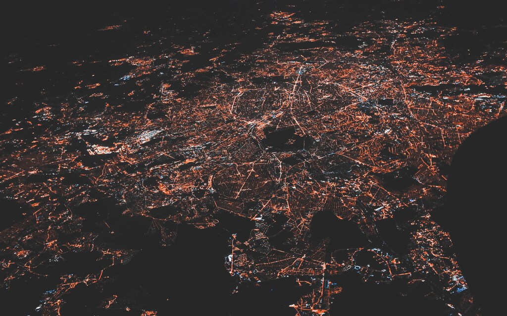 Aerial view of a lighted city at night: Universal connectivity remains a foundational recommendation to G20 members in 2022.