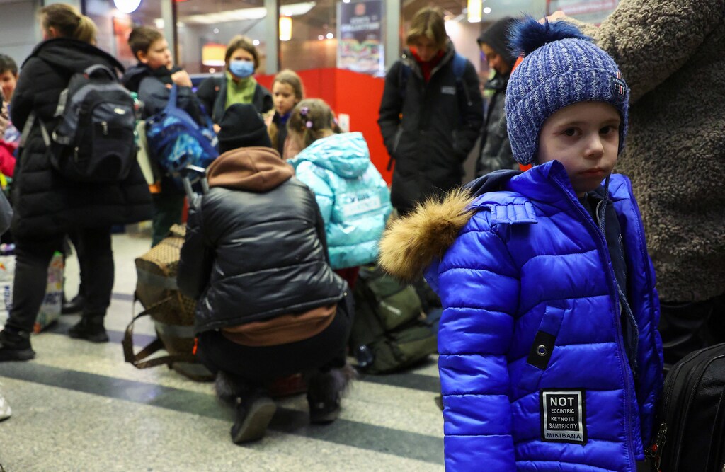 Ukrainian refugees gather at the main train station after fleeing the Russian invasion of Ukraine, in Krakow, Poland, March 15, 2022. Picture taken March 15, 2022. REUTERS/Fabrizio Bensch