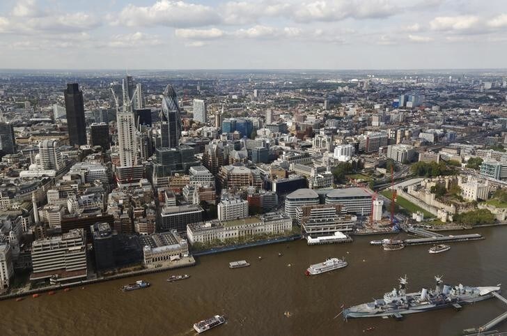 The City of London and the Swiss RE (known as the Gherkin) building and HMS Belfast are seen from the 69th floor of the Shard during its inauguration in London July 5, 2012. REUTERS/Luke MacGregor (BRITAIN - Tags: BUSINESS REAL ESTATE TRAVEL)
