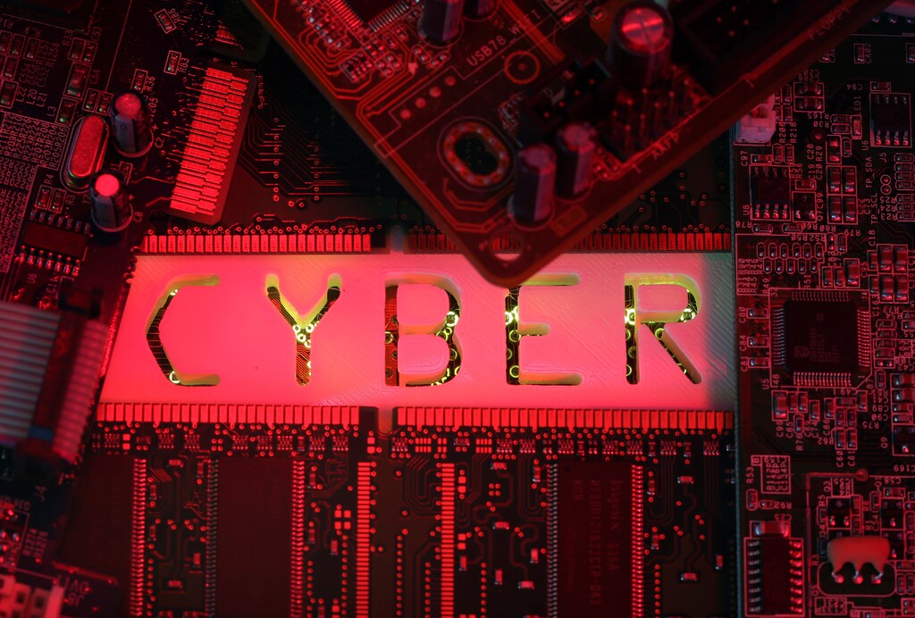 A 3D-printed Cyber word standing on PC motherboard is seen in this illustration picture, October 26, 2017. Picture taken October 26, 2017. REUTERS/Dado Ruvic - RC1D1D94C1F0