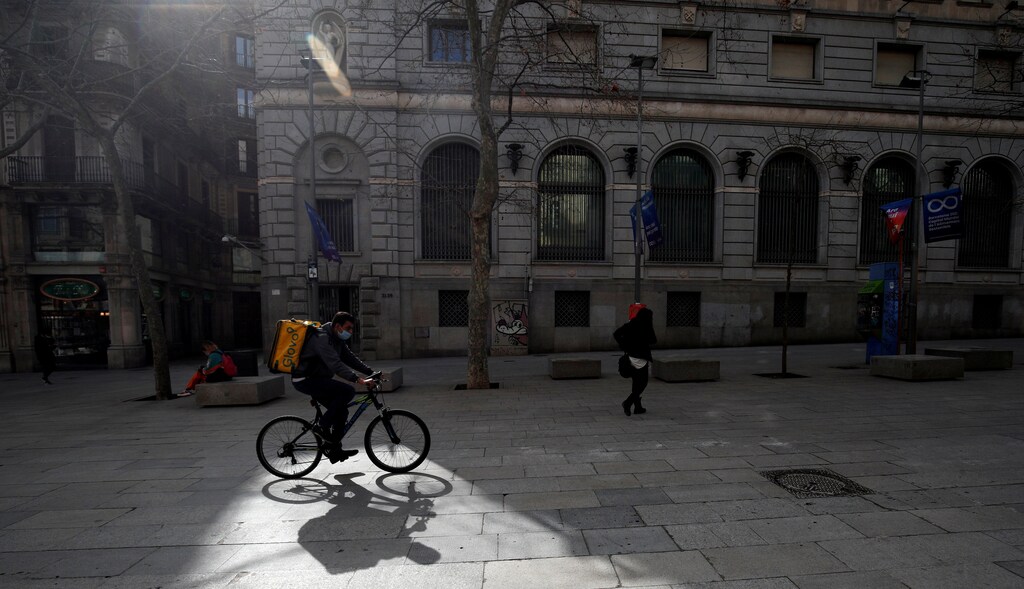 Glovo deliver rider passes through a pedestrian area in Barcelona, Spain, February 23, 2021. Picture taken on February 23, 2021. REUTERS/ Albert Gea TPX IMAGES OF THE DAY - RC2M3M959G33