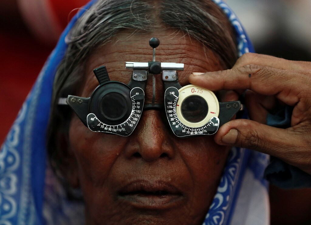 A woman gets her eyes tested at a free eye-care camp on the occasion of Indian politician Babasaheb Ambedkar's death anniversary in Mumbai, India, December 6, 2019. REUTERS/Francis Mascarenhas