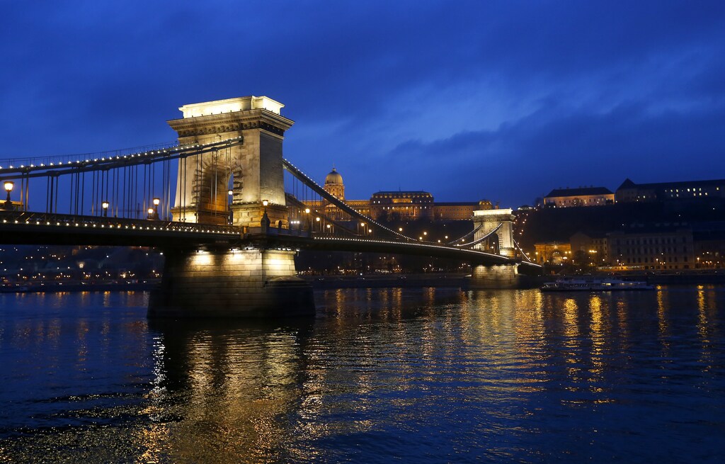 The iconic Chain Bridge of Budapest spans the Danube river and the Royal Palace is seen in the background November 19, 2013. Budapest offers a wealth of choices for lovers of music, art and architecture in a beautiful setting on the Danube river, which bisects the city on the midpoint of its journey from the Black Forest to the Black Sea. To match Trip Tips: TRAVEL-BUDAPEST/ REUTERS/Laszlo Balogh (HUNGARY - Tags: CITYSCAPE SOCIETY TRAVEL) - RTX15NQ9