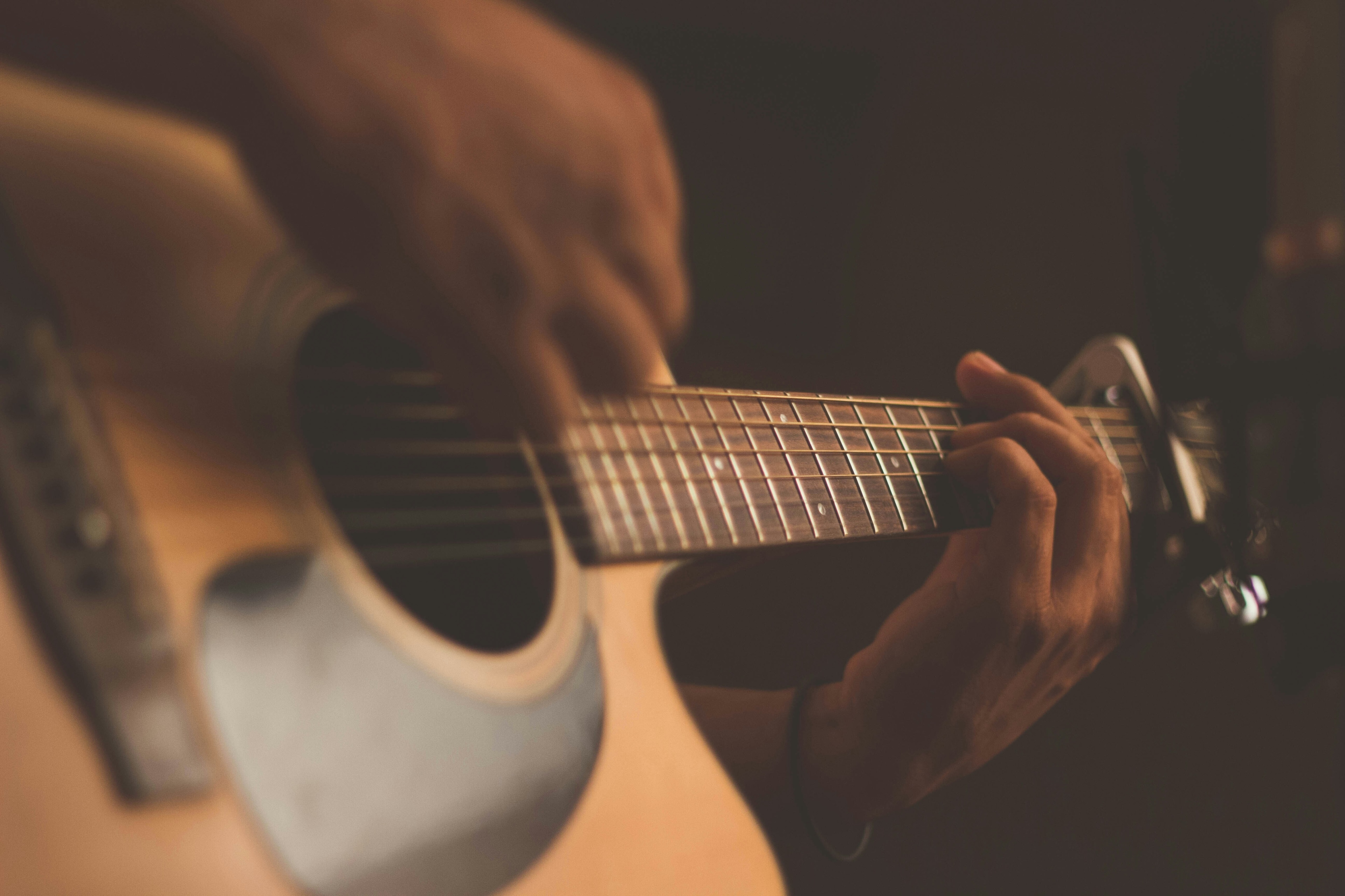 Man playing guitar: Creative platforms should be universally accessible ensuring that the benefits of machine creativity are equitably distributed – creative equity.