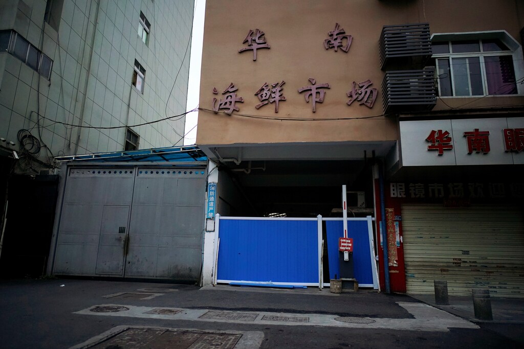 A blocked entrance to Huanan seafood market, where the coronavirus that can cause COVID-19 is believed to have first surfaced, is seen in Wuhan, Hubei province, China March 30, 2020.