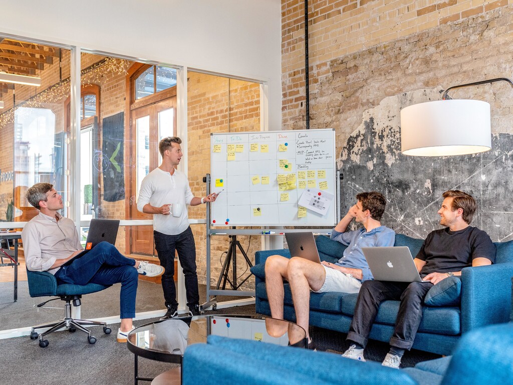 4 people in a meeting.
