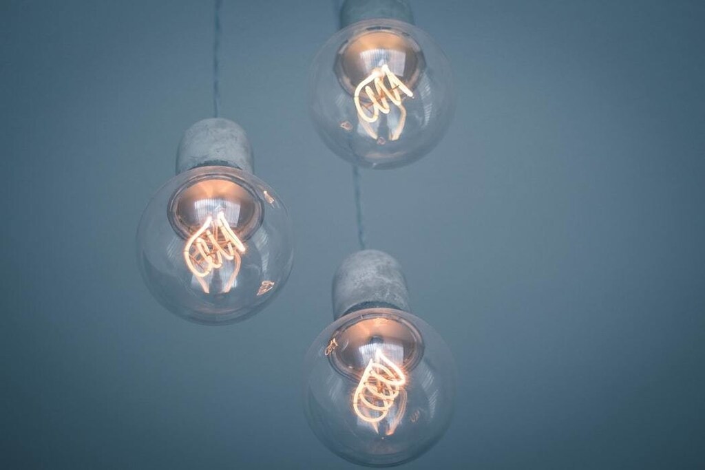 Three lightbulb are pictured