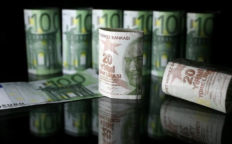 Turkish Lira and Euro banknotes are seen in this picture illustration taken June 25, 2018.