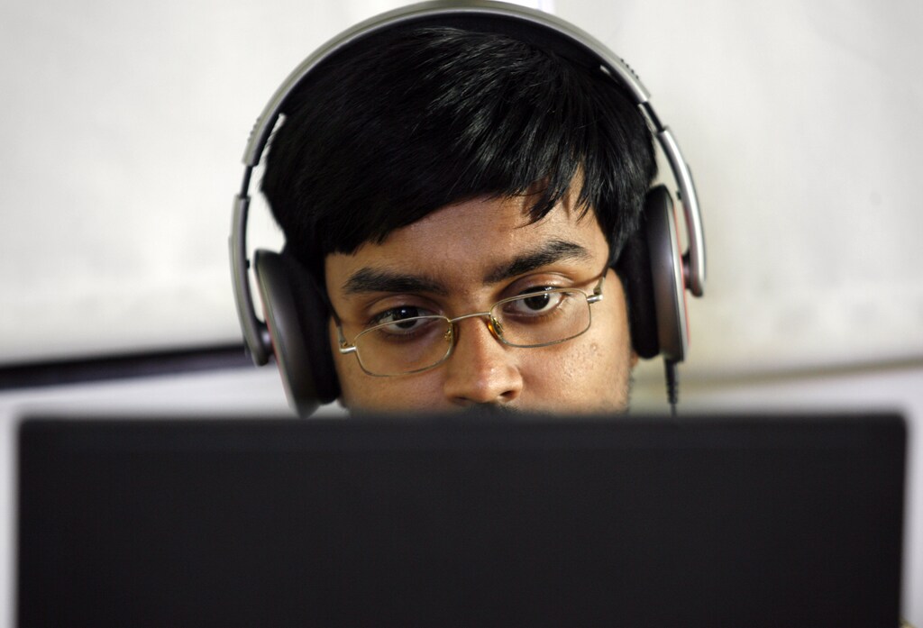 A researcher works on his laptop at the Microsoft India research centre in Bangalore June 24, 2009. Staffed with about 60 full-time researchers, many of them Indians with PhDs from top universities in the United States, the centre is at the cutting edge of Microsoft's R&D. It covers seven areas of research including mobility and cryptography. Its success, including developing a popular tool for Microsoft's new search engine Bing, underscores the potential of R&D in India at a time when cost-conscious firms are keen to offshore to save money by using talented researchers abroad. To match feature INDIA-R&D/ REUTERS/Punit Paranjpe (INDIA SCI TECH BUSINESS) - GM1E57L0LK401