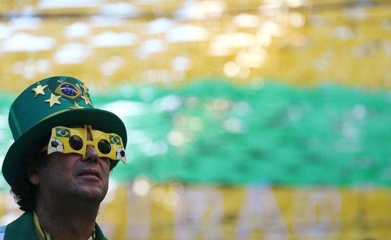 A fan watches the broadcast of the FIFA World Cup Group E soccer match between Brazil and Switzerland, in Rio de Janeiro, Brazil June 17, 2018. REUTERS/Sergio Moraes - RC1471639DE0