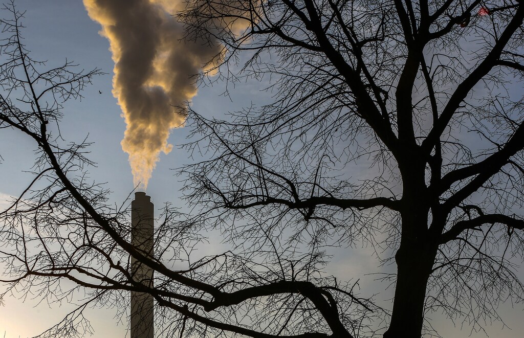 Smoke rises from a chimney of a garbage processing plant on the outskirts of the Belgian city of Brussels March 10, 2016. Picture taken March 10, 2016 REUTERS/Yves Herman - RTX293U9