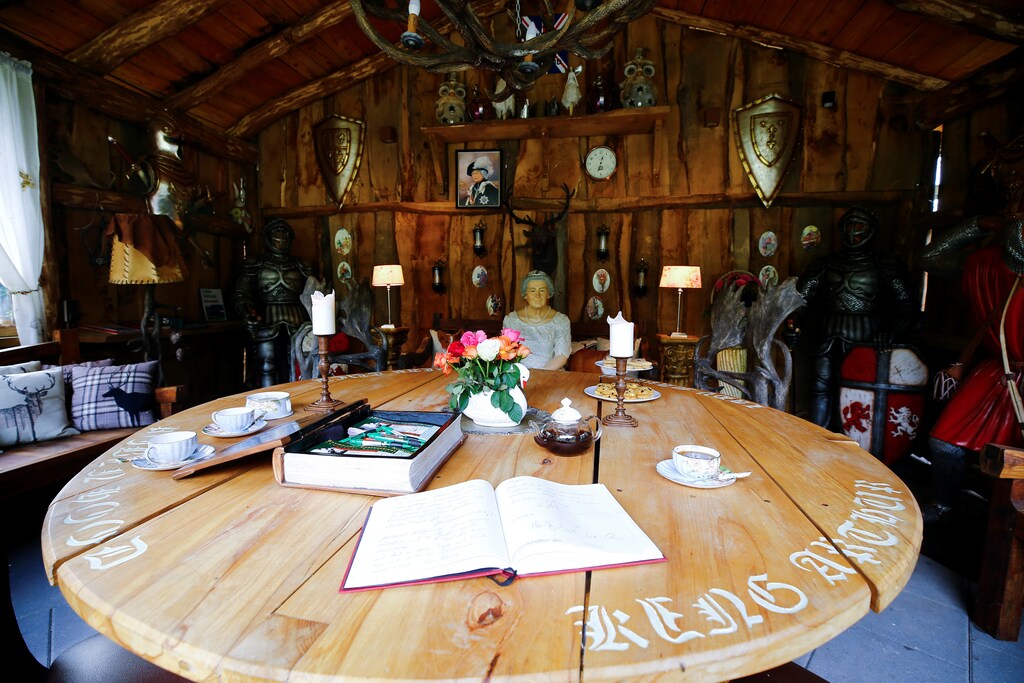British curiosities are placed around a mock-up table of "King Arthur's round table of the knights" at the curiosity collection called "Little Britain" of Gary Blackburn, a 53-year-old tree surgeon from Lincolnshire, Britain, in Linz-Kretzhaus, south of Germany's former capital Bonn, Germany, August 24, 2017. Picture taken August 24, 2017. REUTERS/Wolfgang Rattay - RC1E9869D3C0
